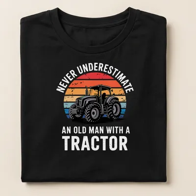 Retro distressed Tractor Driver shirt with colorful text and tractor graphic — printed on a women's shirt