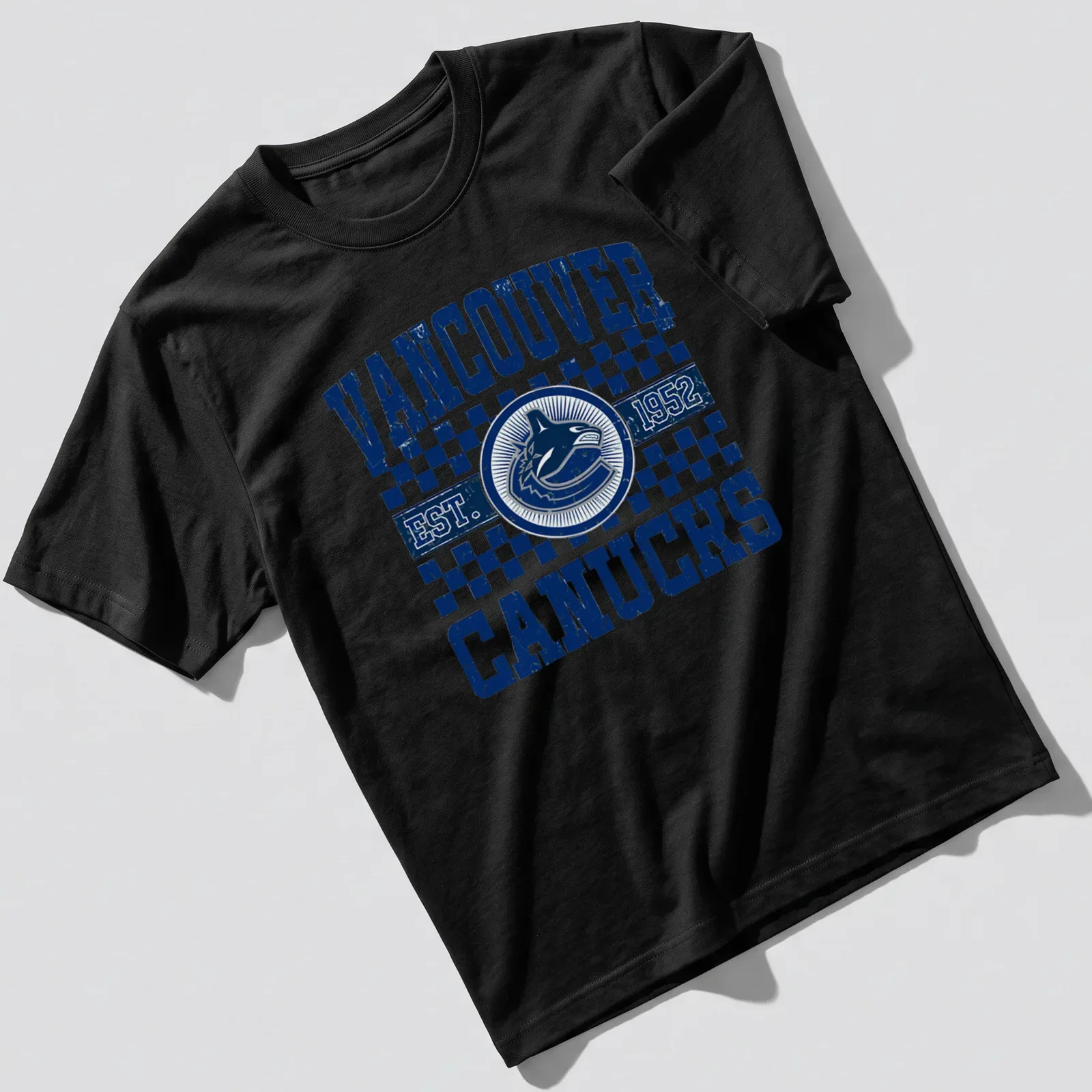 Vintage distressed Vancouver Canucks T-shirt with bold lettering — printed on a unisex t-shirt