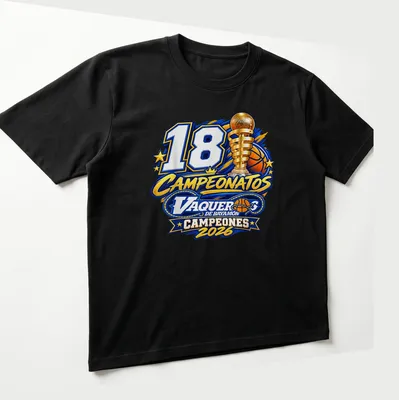Basketball trophy graphic with '18 Campeonatos Vaqueros De Bayamon Campeones 2026' text — printed on a unisex t-shirt (angled view)
