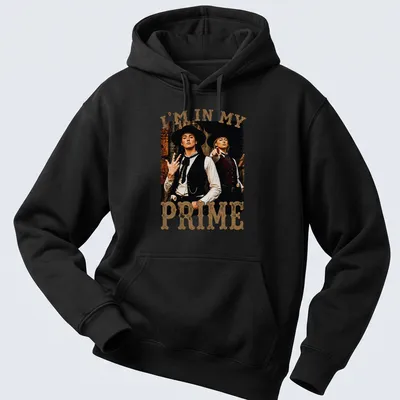 Vintage distressed shirt with Western characters and bold text "I'm In My Prime" — printed on a unisex hoodie