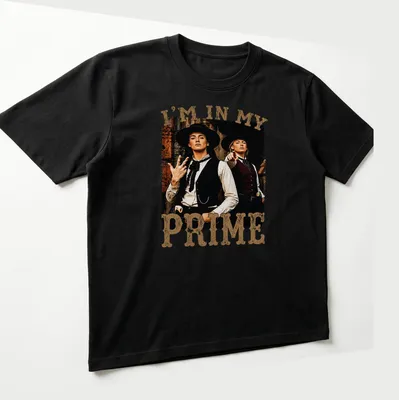 Vintage distressed shirt with Western characters and bold text "I'm In My Prime" — printed on a unisex t-shirt (angled view)