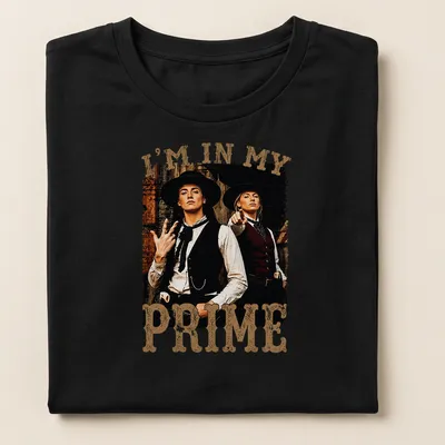 Vintage distressed shirt with Western characters and bold text "I'm In My Prime" — printed on a women's shirt