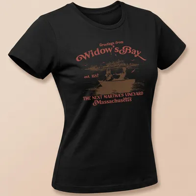 Vintage rowboat scene with 'Greetings from Widow's Bay' text in red, white, and black — printed on a women's shirt