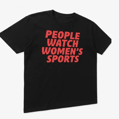 Bold typography t-shirt promoting women's sports with red lettering — printed on a unisex t-shirt (angled view)